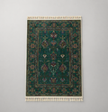 Tapis moderne vert foncé aux motifs traditionnels d'orient